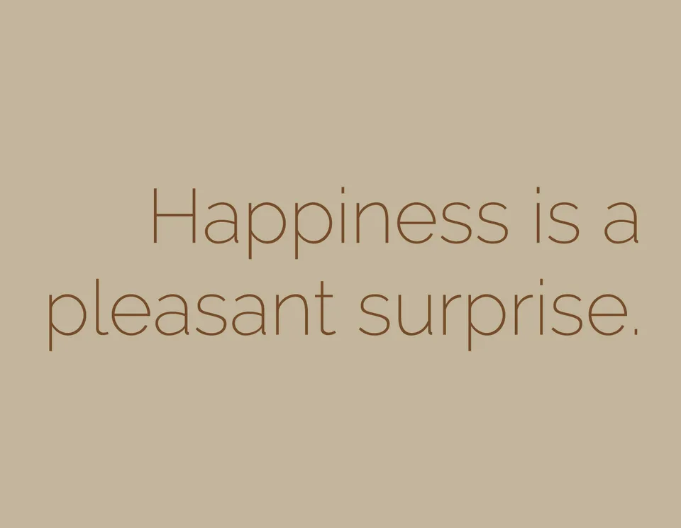 Brown lettering on beige reads: Happiness is a pleasant surprise.